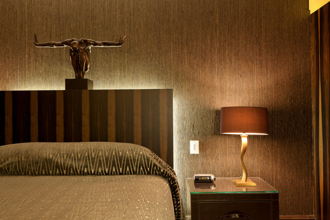 bedroom with warm lighting and bedside table lamp